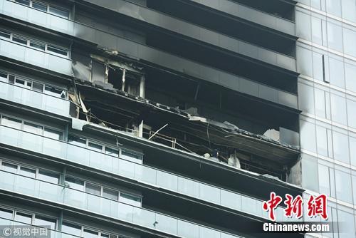 图为起火大楼。图片来源：视觉中国